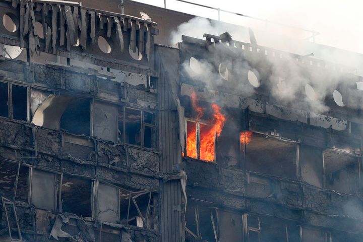 Flames and smoke continue to engulf Grenfell Tower in London on Wednesday.