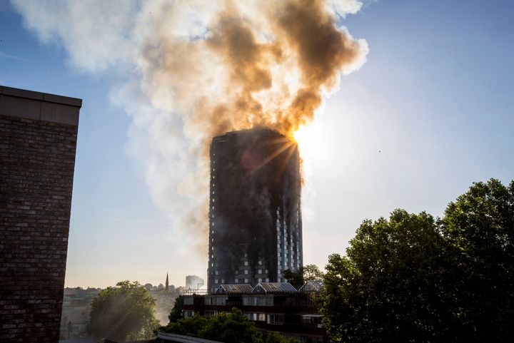 Smoke billows from the 24-story Grenfell Tower in Kensington, west London.