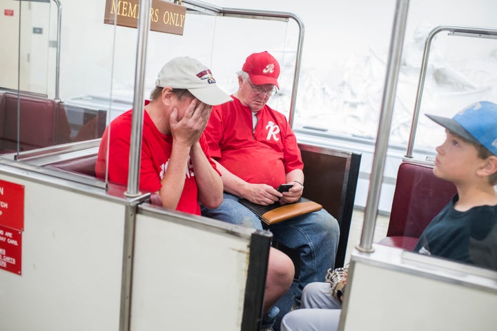 Rep. Joe Barton (R-Texas), center, and his sons board the Rayburn subway in the basement of the Capitol after the shooting.