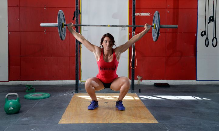 DENVER, CO - AUGUST 18: Emily Schromm 2014 Next Fitness Star for Women's Health and a CrossFit competitor at her Park Hill CrossFit studio, 2857 Fairfax Street in Denver on Monday, August 18, 2014. Schromm demonstrates some of the highlights from her CrossFit workouts including this snatch lift. (Denver Post Photo by Cyrus McCrimmon) Cyrus McCrimmon via Getty Images