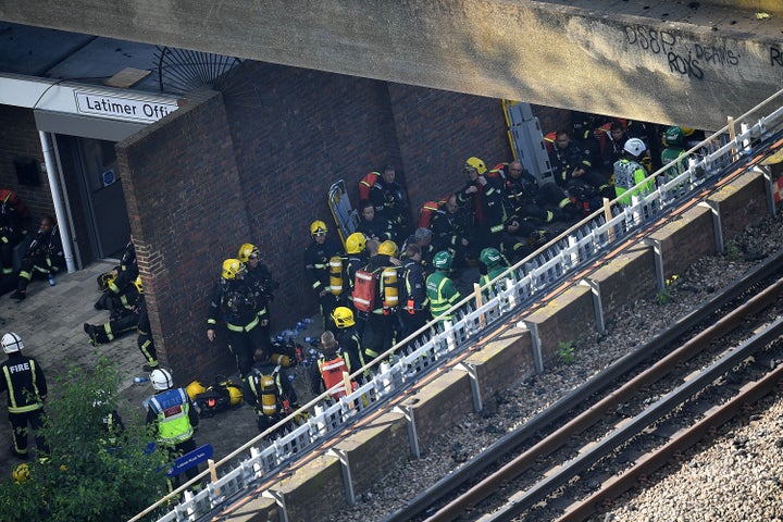 Fire fighters gather near the building to tackle the blaze