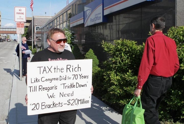 James Hodgkinson protests outside the United States Post Office in downtown Belleville, Illinois.