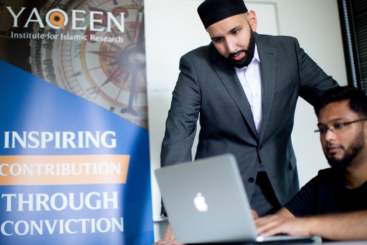 Imam Omar Suleiman and Ali Fiaz, the operations manager at Yaqeen Institute, at work in Las Colinas, Texas.