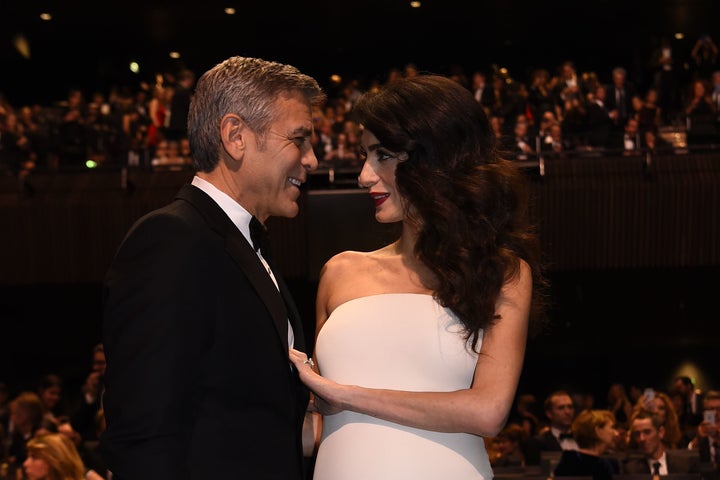 Amal and George Clooney look just as smitten four years later. 