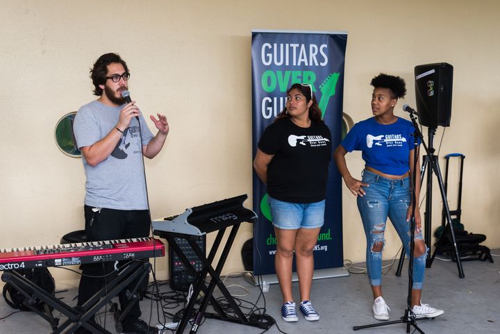 <p>Young artists from the Guitars over Guns program take the stage at Common Threads’ Family Takeover event.</p>