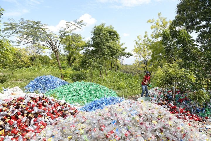 <p>Piles of plastic bottles collected and sorted in Haiti.</p>