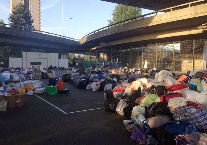 Tennis courts at the Westway Sports Centre close to the scene which are overflowing with donated provisions