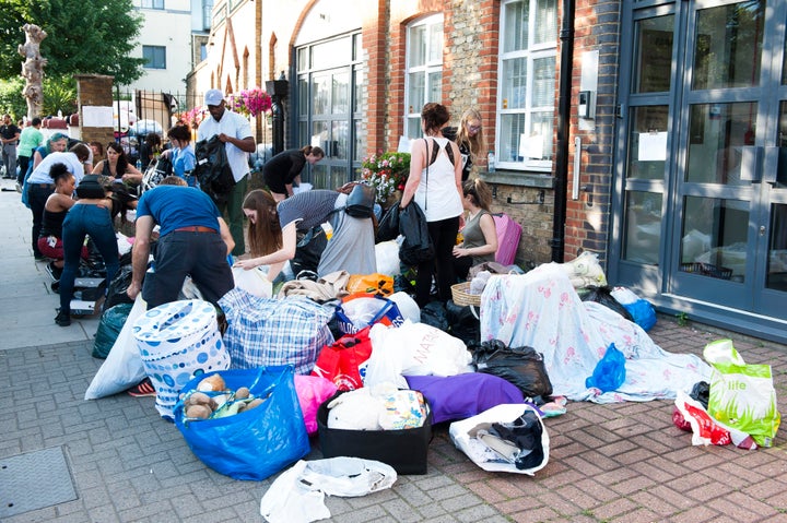 Volunteers sort through clothes donated to help the people affected