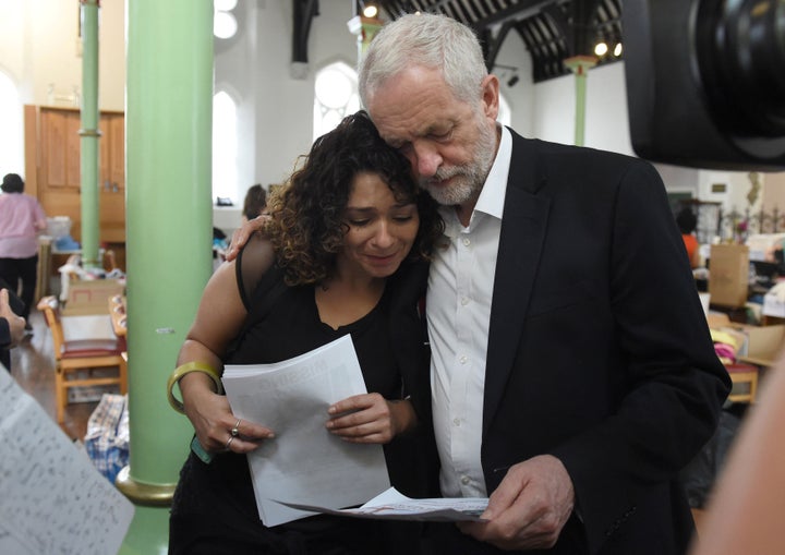 Britain's oppositon Labour Party leader Jeremy Corbyn meets a local resident at St Clement's Church, following a fatal fire in a tower block, in north Kensington in west London, Britain June 15, 2017.