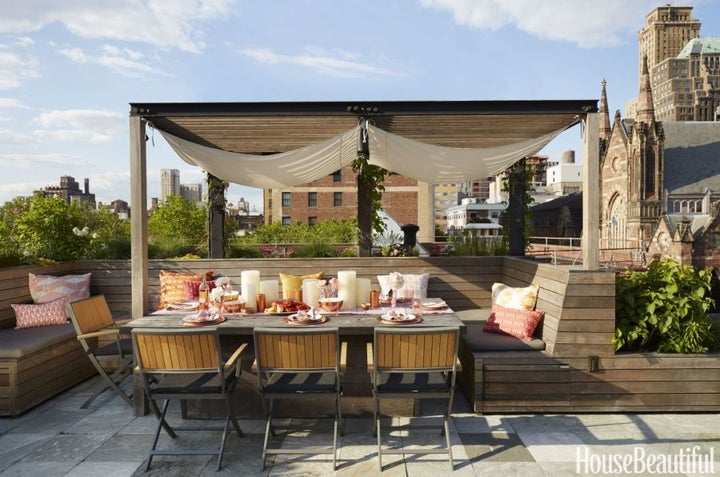 Above, warm wood tones and a pergola add an intimate feel to the rooftop patio of a Brooklyn brownstone.