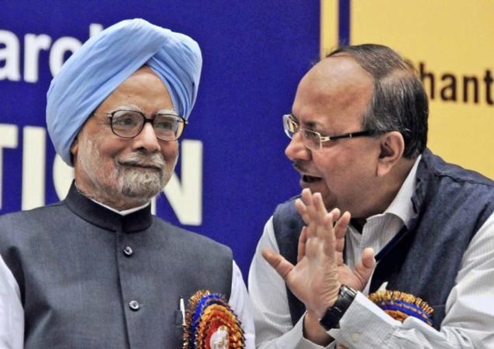 Former Indian Prime Minister Manmohan Singh with Samir Brahmachari in 2013.