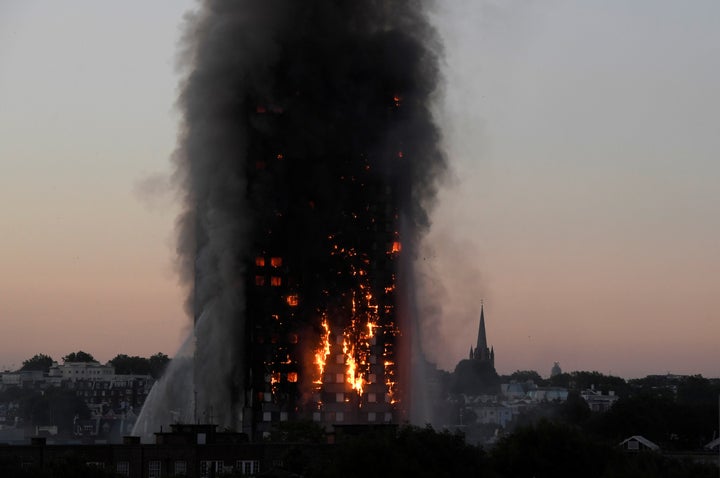 Flames and smoke billow as firefighters deal with a serious fire in the Grenfell Tower apartment block at Latimer Road in west London, June 14, 2017.