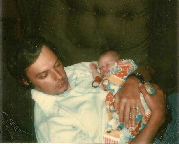 Dad holding newborn me, while I slept. July, 1974