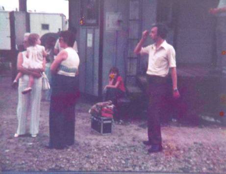 <p><em>One of my very young trips to see a train, in Zebulon. My grandmother is holding me on the left, Dad is on the right. He was filming a news story for WRAL.</em> </p>