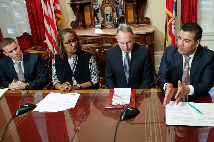 <p>California Senator Ricardo Lara<em> </em>(D-Bell Gardens) speaks with Senators Mike McGuire, Holly Mitchell, and Richard Roth in Sacramento. June 13, 2017 </p>