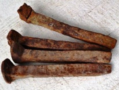 <p><em>The type of rusted metal spikes Dad & I would pick up along the railroad tracks.</em></p>