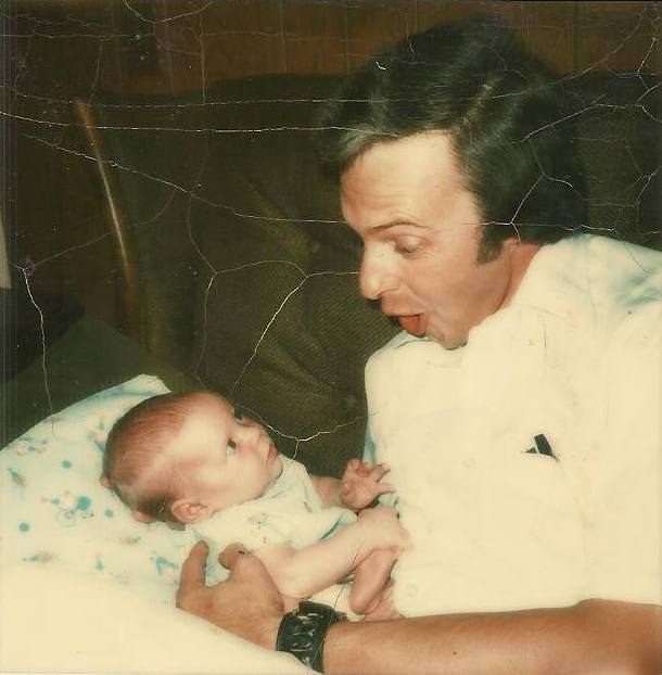<p><em>Dad, trying to elicit a smile from me as a newborn, July 1974</em></p>
