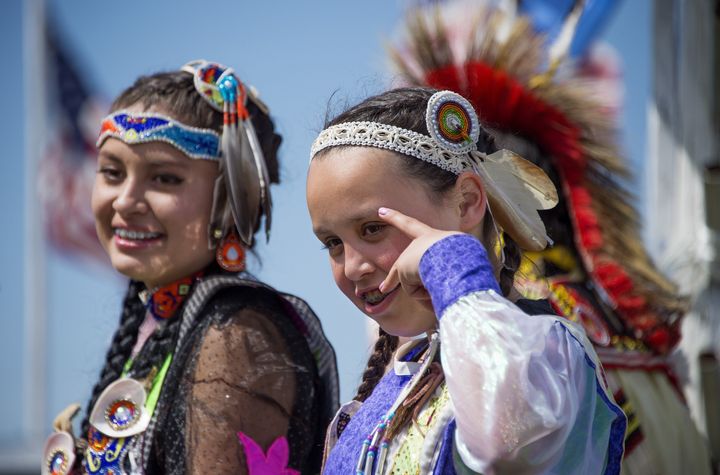 Native American dancers perform for U.S. President Barack Obama during the Cannon Ball Flag Day Celebration in Cannon Ball, N