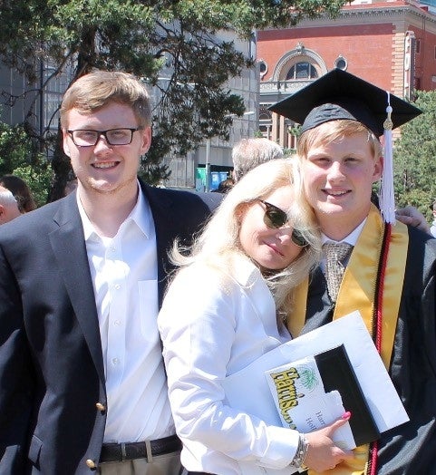 Nancy with her sons at Chance's recent high school graduation.