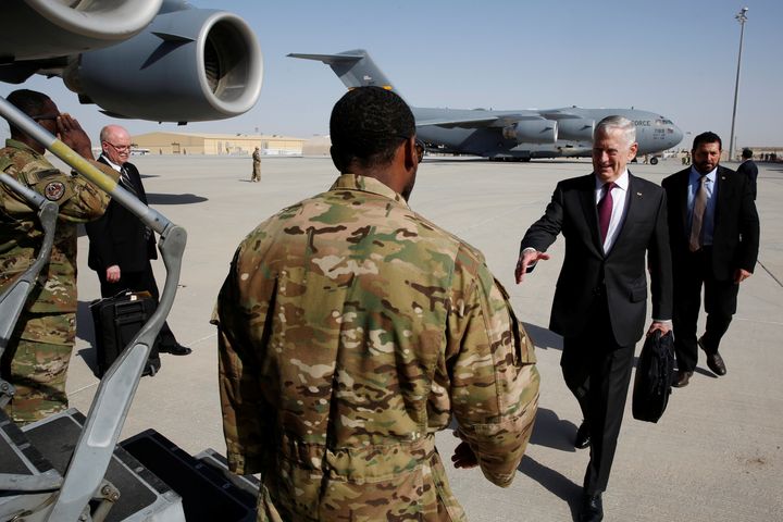 Defense Secretary James Mattis greets an airman as he boards a U.S. Air Force C-17 for a day trip to a U.S. military base in Djibouti from Doha, Qatar April 23, 2017.