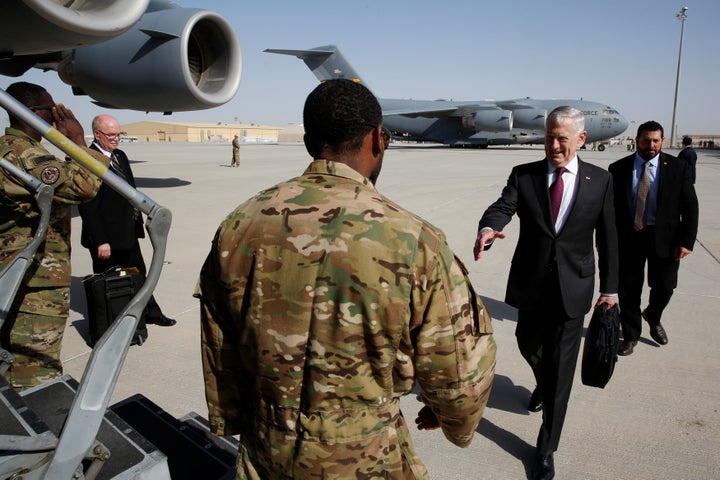 Defense Secretary James Mattis greets an airman as he boards a U.S. Air Force C-17 for a day trip to a U.S. military base in Djibouti from Doha, Qatar April 23, 2017.