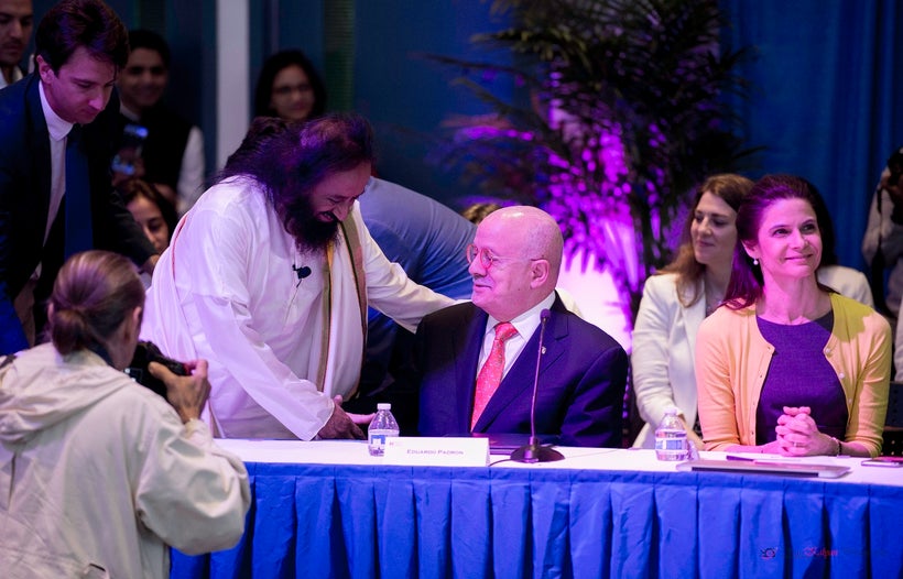 Sri Sri greeting Eduardo Padron, the President of Miami-Dade College.