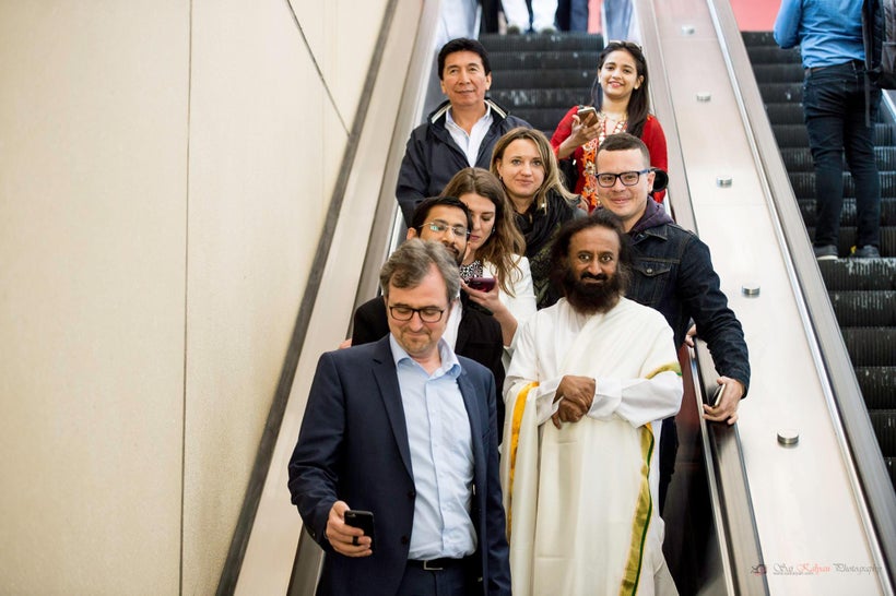 Sri Sri out for a walk after H2O discussing the many happiness projects he spearheads