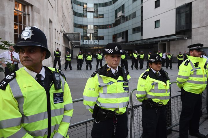 Police Officers stand guard outside Broadcasting House