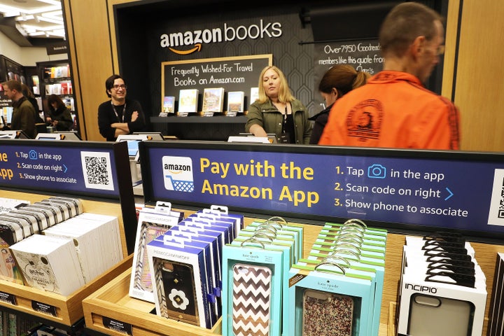 People shop in the newly opened Amazon Books on May 25 in New York City. Amazon Books, like the Amazon Go store, does not accept cash and instead lets Prime members use the Amazon app on their smartphone to pay for purchases. Non-members can use a credit or debit card.