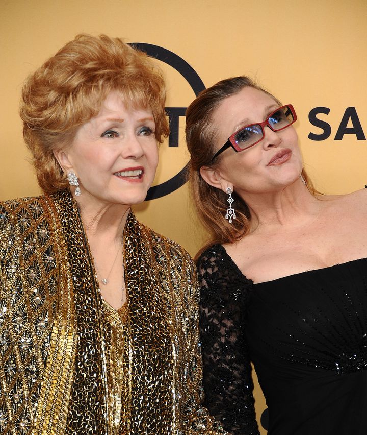 Actress Debbie Reynolds poses with her daughter, actress Carrie Fisher, in the press room at the Screen Actors Guild Awards on January 25, 2015.