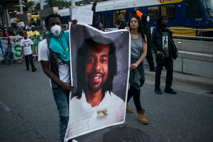 Protesters carry a portrait of Philando Castile on June 16, 2017 in St Paul, Minnesota.