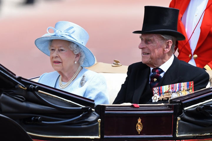 The queen and Prince Philip arriving.