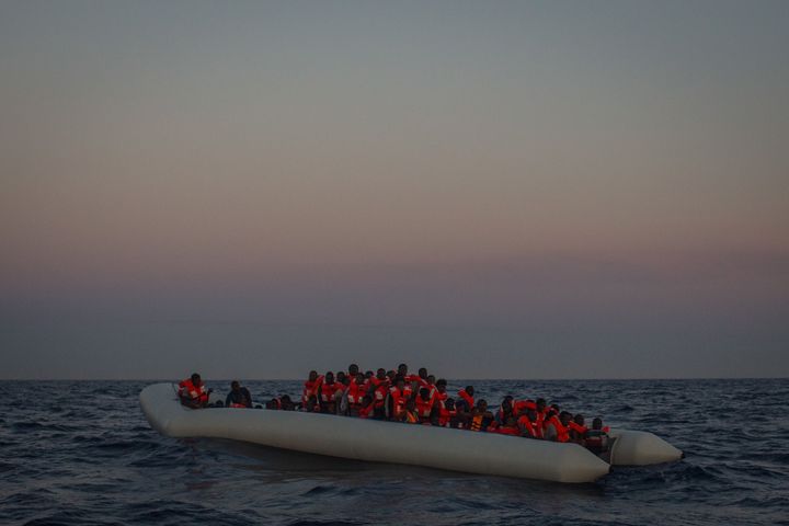 Refugees and migrants wait in a small rubber boat to be rescued by the crew of the Migrant Offshore Aid Station Phoenix vessel off Lampedusa, Italy, on June 10.