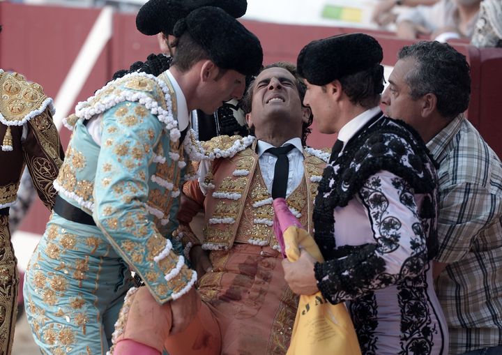 Ivan Fandino is assisted after being impaled by a Baltasar Iban bull during a bullfight at the Corrida des Fetes on June 17, 2017 in Aire sur Adour, southwestern France.
