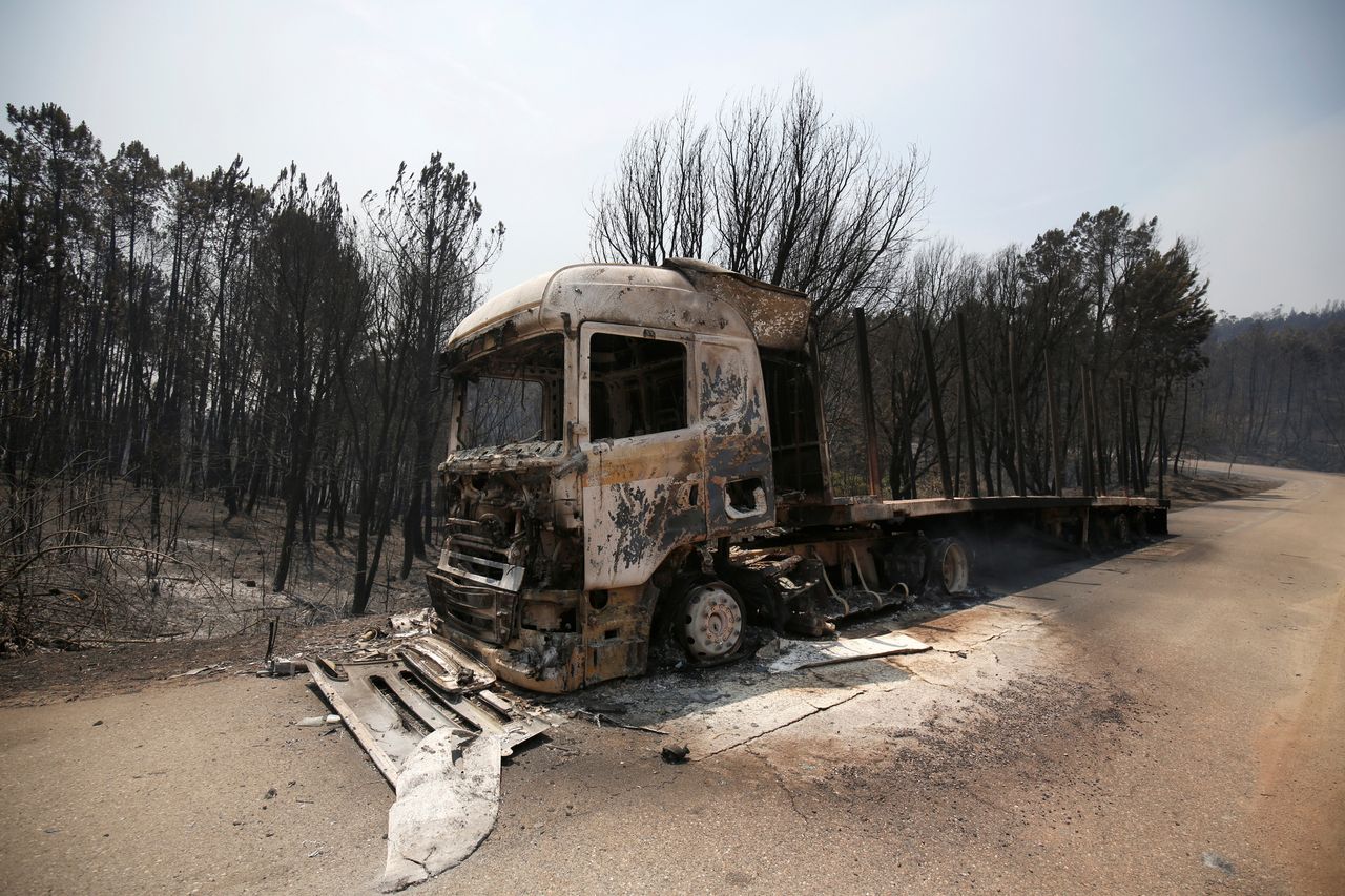 A burned truck is seen during a forest fire near Figueiro dos Vinhos, Portugal.