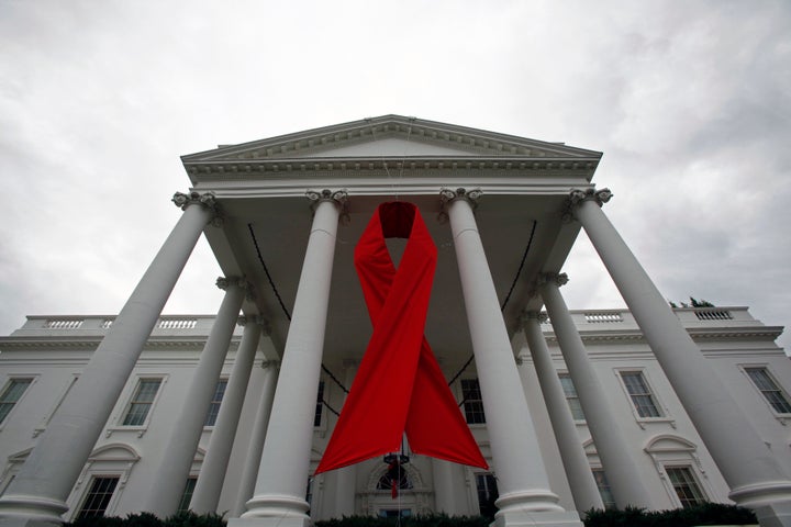 An AIDS ribbon hangs from the North Portico of the White House in recognition of World AIDS Day, November 30, 2010.