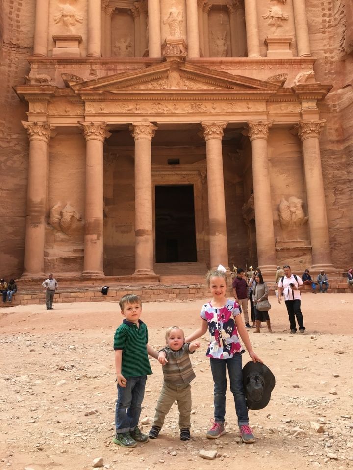 Three explorers at the Petra Treasury. 