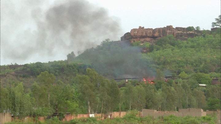 Flames rise following an attack where gunmen stormed Le Campement Kangaba resort in Dougourakoro.