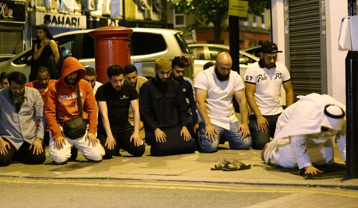 Local people observe prayers after one person died and ten others injured in the terror attack in Finsbury Park.
