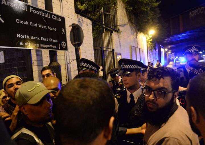Police officers talk with local people at Finsbury Park following the incident
