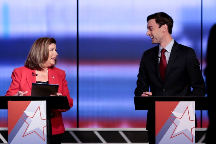 Republican candidate Karen Handel and Democratic candidate Jon Ossoff exchange words moments before Georgia's 6th Congressional District special election debate on June 6, 2017.