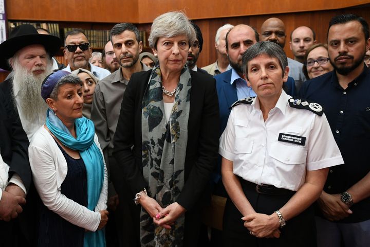 Theresa may and Met Police Commissioner Cressida Dick talk to faith leaders.