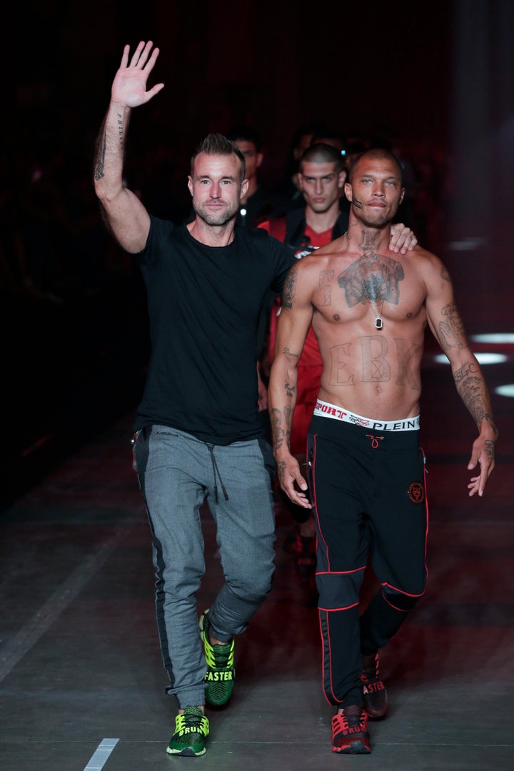 Philipp Plein and Jeremy Meeks walking the runway together. 