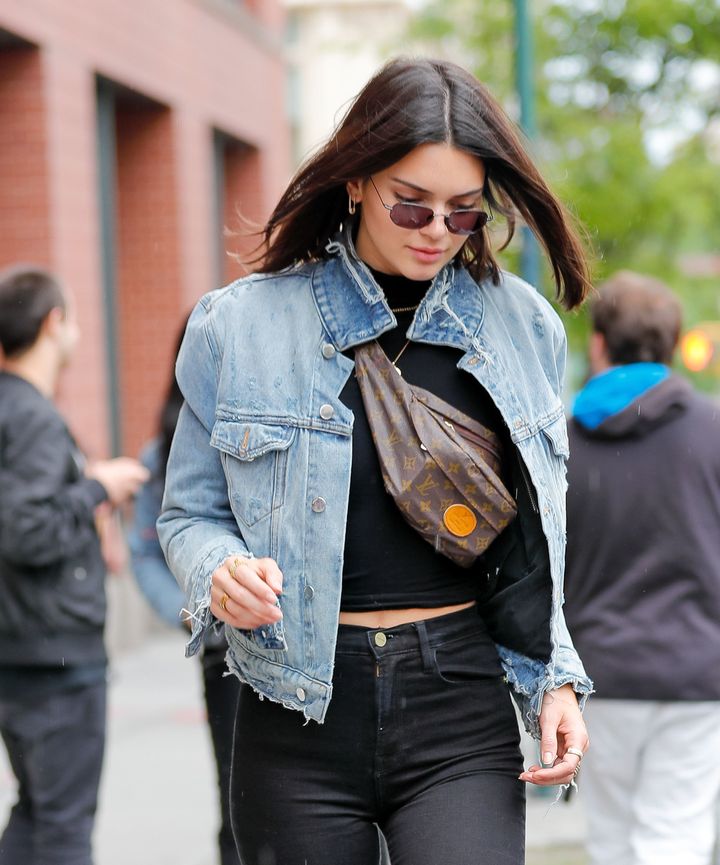 Kendall Jenner continues her luxury fanny pack fashion craze by wearing it across her chest when out and about with BFF Hailey Baldwin in New York on June 4. 