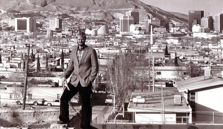 Journalist David M. Hancock seen here in 1986-87, standing on a hill in Ciudad Juarez with downtown El Paso, Texas, in the ba