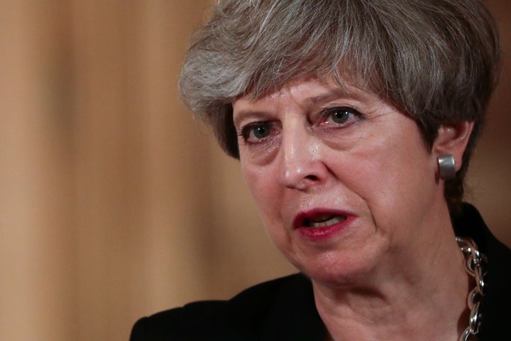 British Prime Minister Theresa May speaks during a news conference in London. 