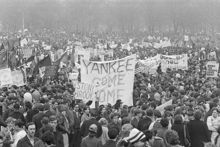 Demonstrators carry banners and signs during a Vietnam War protest in New York's Central Park on April 15, 1967.