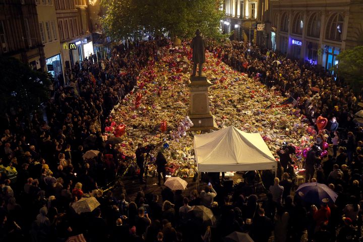 People attend a vigil for the victims of the Manchester attack