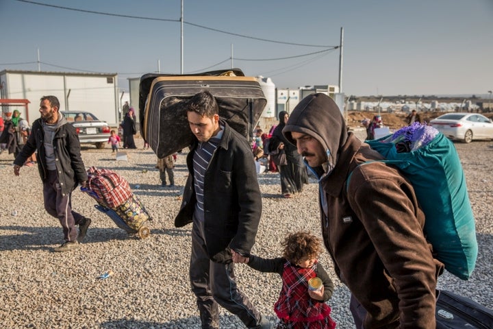 Iraqi families displaced from Mosul arrive at UNHCR’s Hasansham camp in Iraqi Kurdistan in January 2017. 