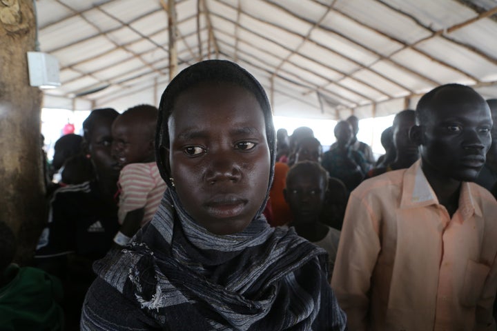 People who fled fighting in South Sudan queue on arrival at Bidi Bidi refugee’s resettlement camp near the border in northern Uganda on Dec. 7, 2016.